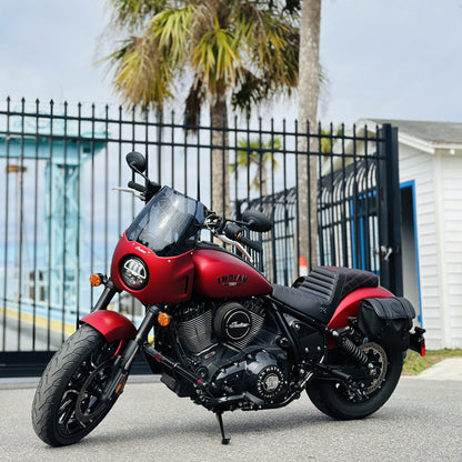 Red Indian motorcycle parked outdoors, highlighting custom parts, Quebec custom motorcycle shop