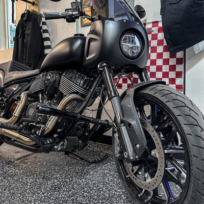 Custom Harley-Davidson motorcycle with performance upgrades at Quebec's Lawless Garage, handcrafted parts visible.