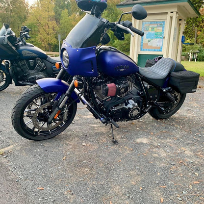 Custom Indian motorcycle parked outdoors, showcasing performance upgrades and handcrafted parts from a Quebec Canada shop specializing in Harley-Davidson and American bike customization.