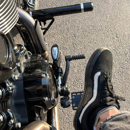 Close-up of custom Harley-Davidson foot controls and shifter, Lawless Garage Quebec, performance upgrade