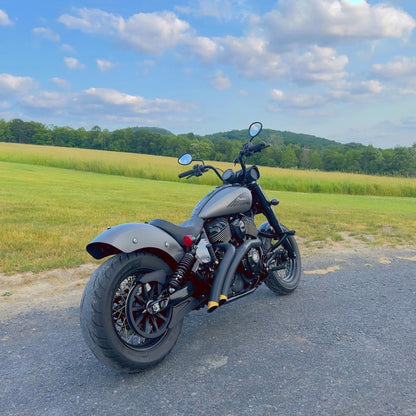 Custom Indian motorcycle with performance upgrades parked on rural road, Harley-Davidson and handcrafted bike parts, Lawless Garage Quebec Canada.