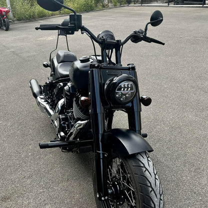 Custom black Indian Motorcycle with performance upgrades, parked outside Lawless Garage, Quebec