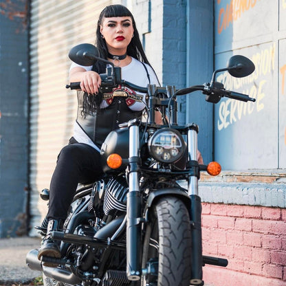 Woman on custom Harley-Davidson motorcycle, Lawless Garage Quebec, handcrafted bike parts
